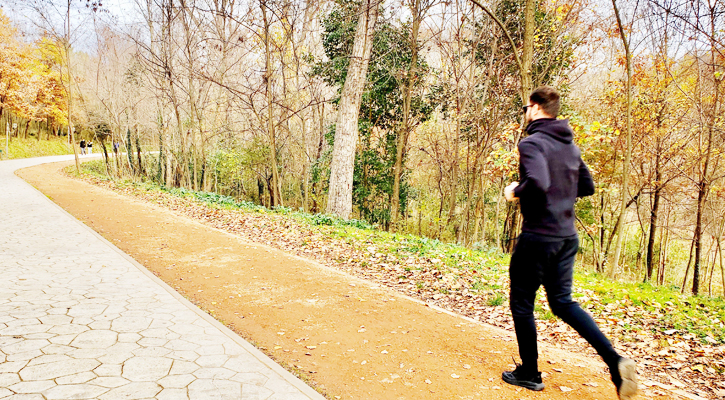 Running boy in lake park