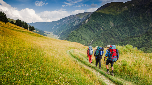 people hiking on the mountains