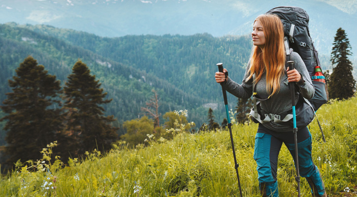 woman hiking on a mountain trail