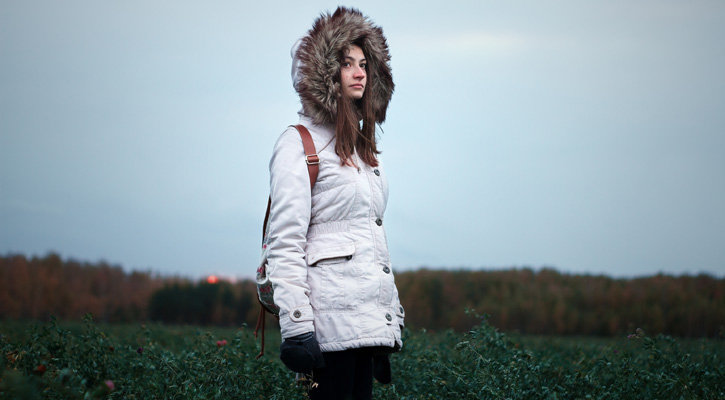 woman wearing winter jacket on a field