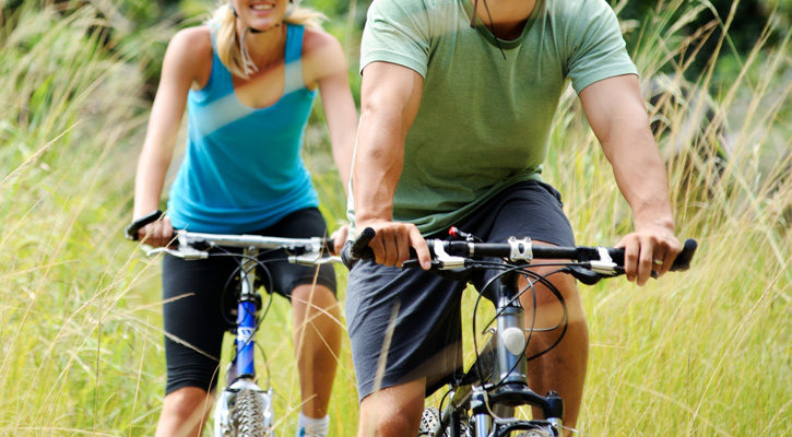 young couple outdoor cycling