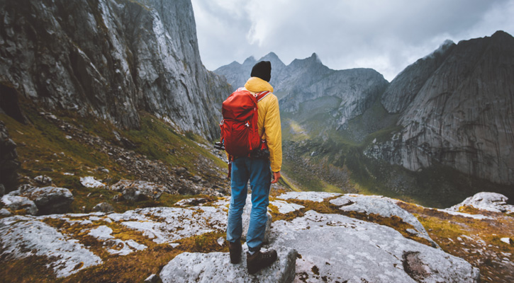 man hiking in the mountains in Norway