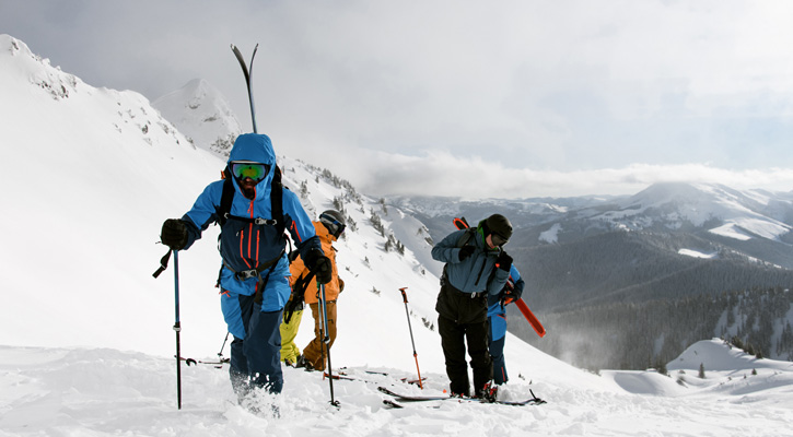 people climbing snowy mountain