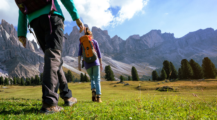 two hikers on a mountain trail