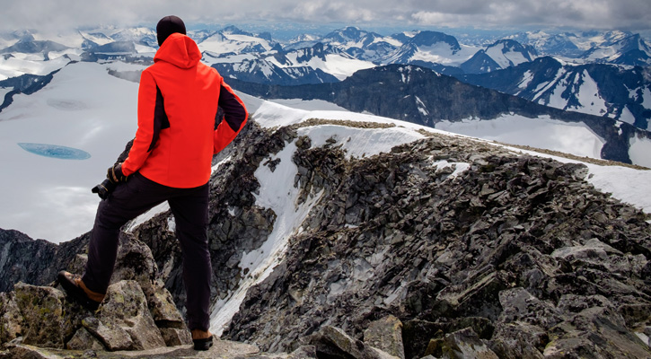 climber on top of a mountain