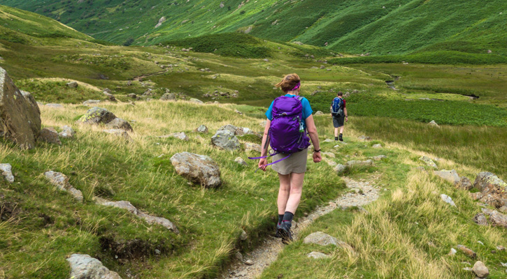 couple hiking on a mountain trail