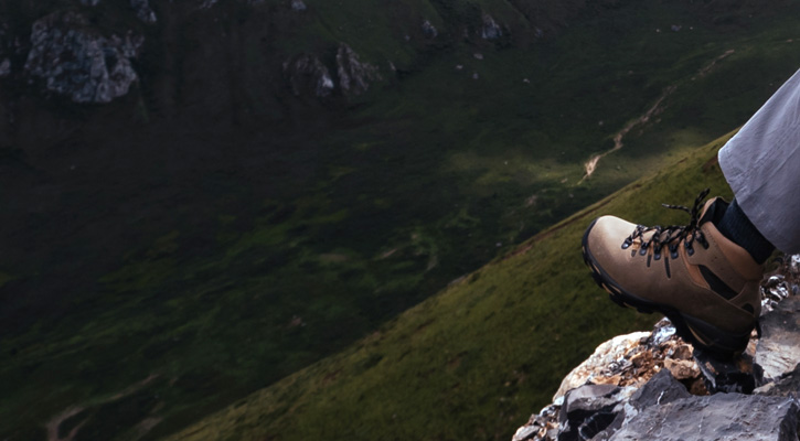 hiking boot on top of a mountain close up