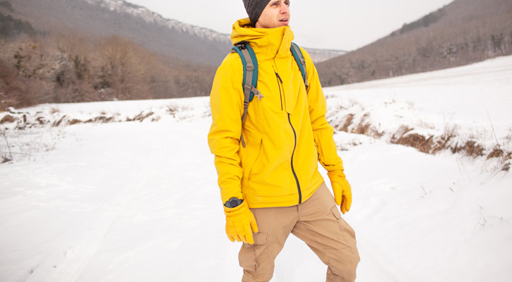 man hiking in the snow