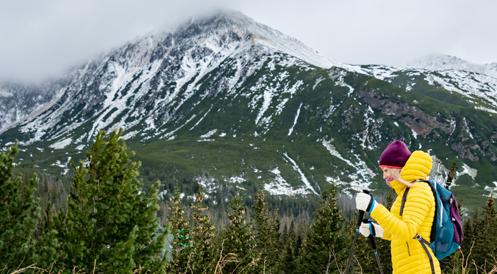 woman hiking in a snowy forest