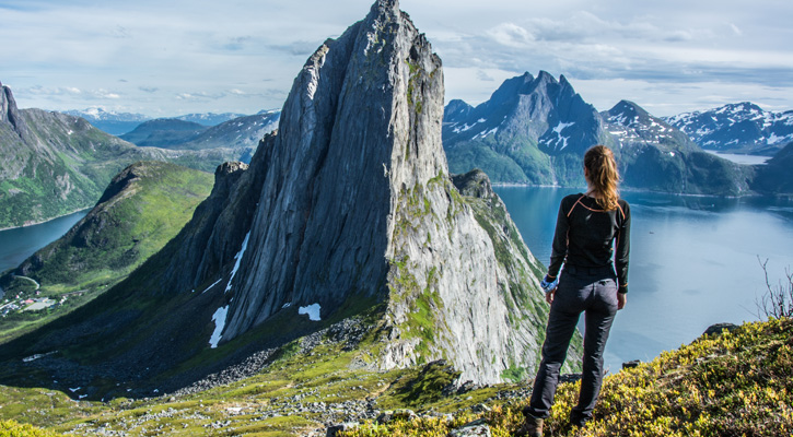 woman hiking on top of a mountain