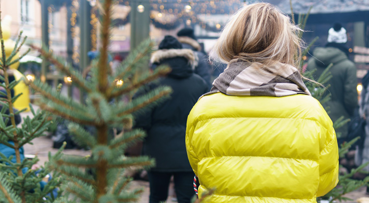 woman wearing yellow winter down jacket