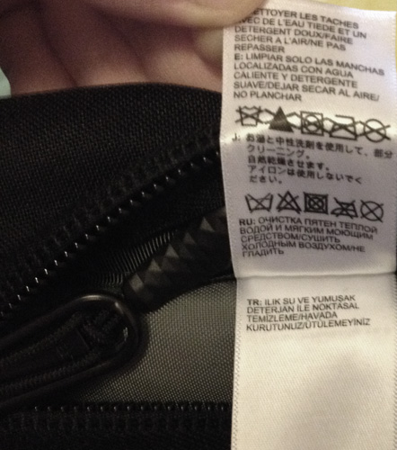 The North Face backpack care instructions tag
