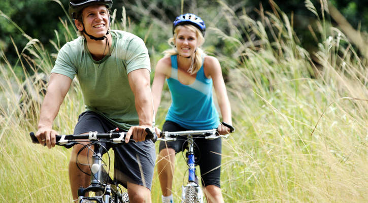 a couple biking outside