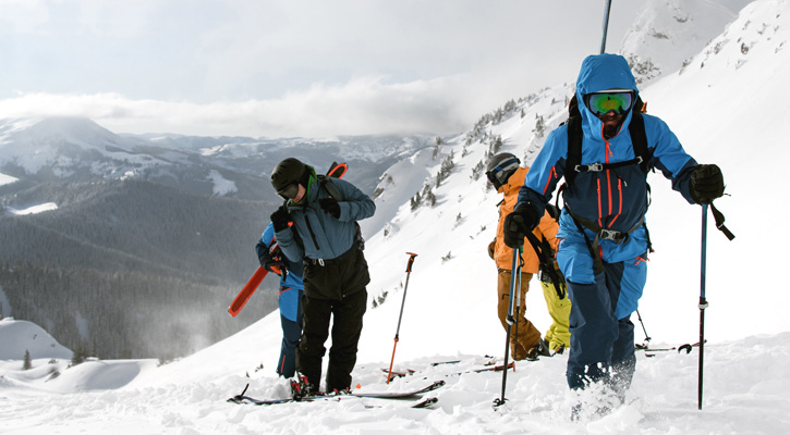 mountaineers climbing a snowy mountain