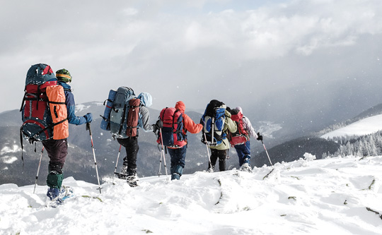 mountaineers on a snowy mountain