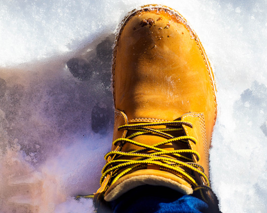 Timberland yellow boot on snow