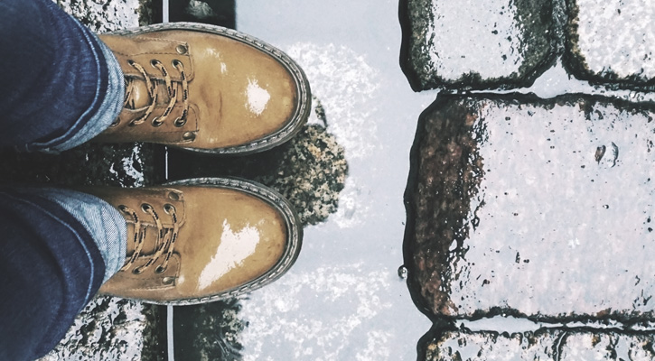 a pair of boots in the rain